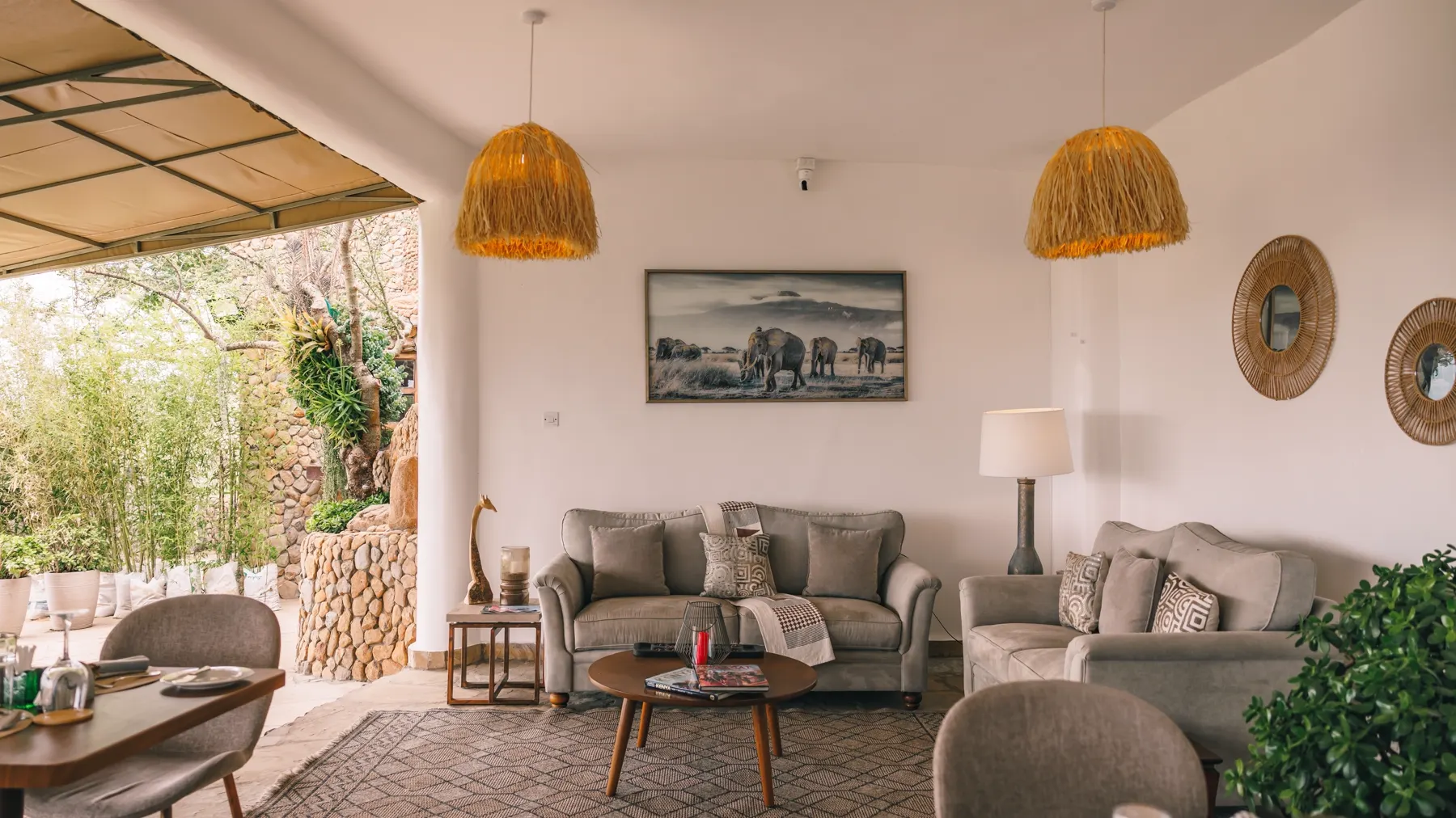 The lounge and dining area with woven pendant lights