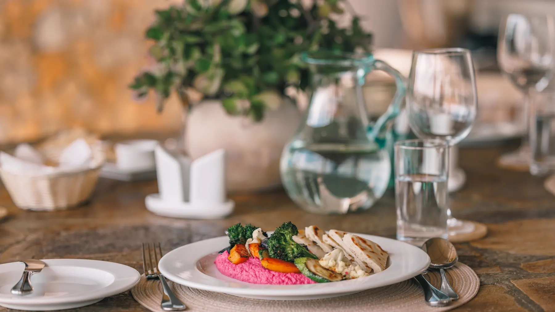 Table setting with a plated main course