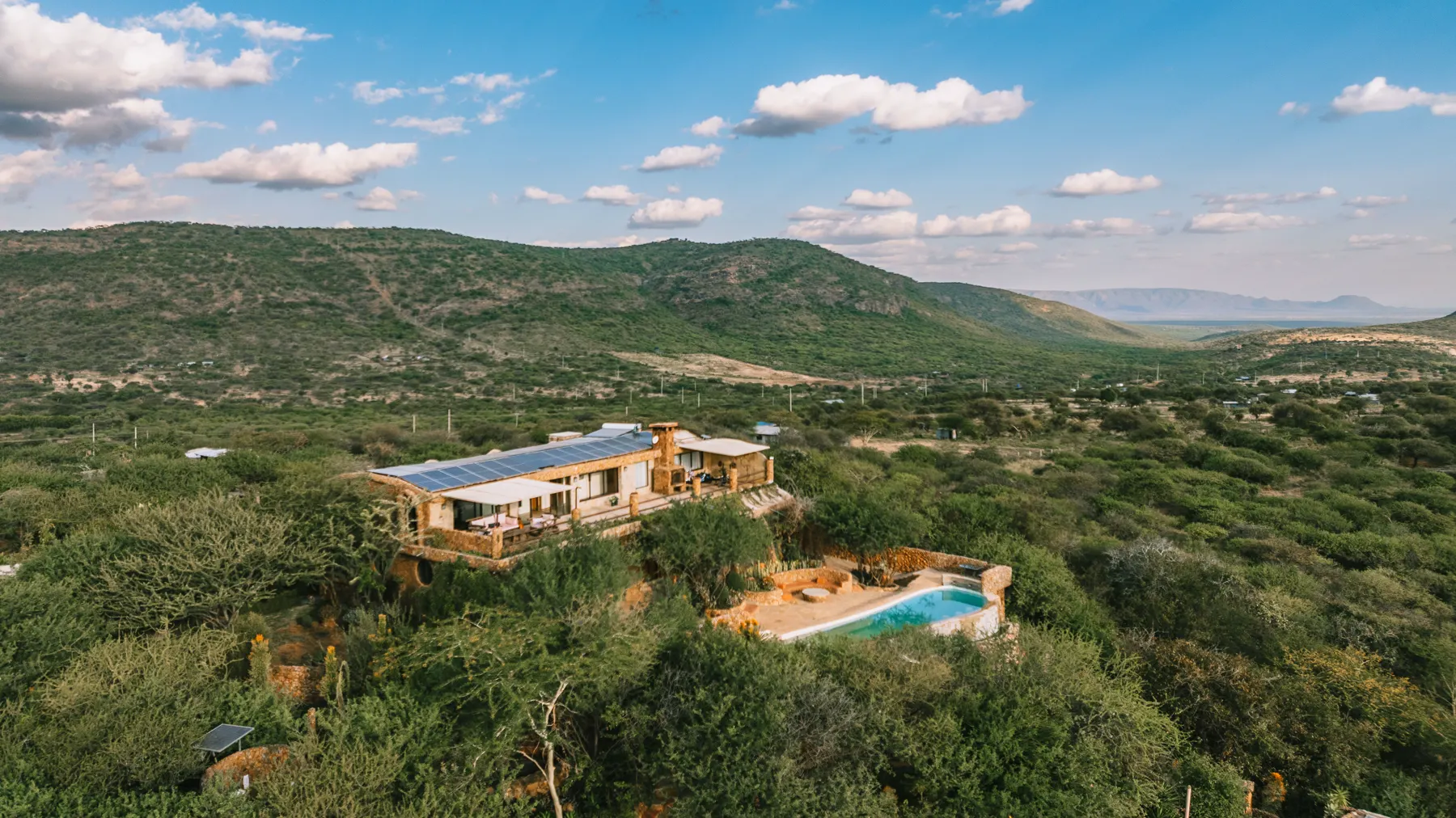 Aerial view of the solar-powered lodge above the valley