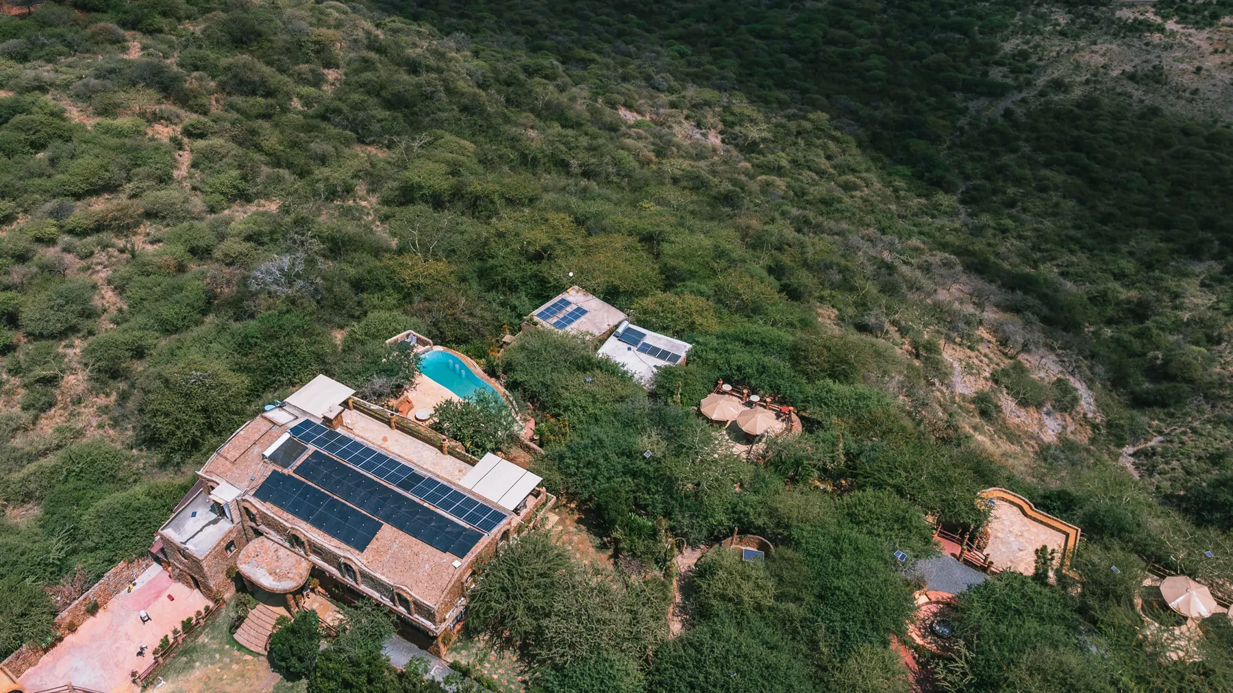Rooftop solar arrays across the lodge and cottages