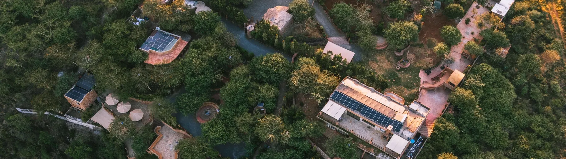 Aerial view of the solar-powered lodge and cottages at Enkaji